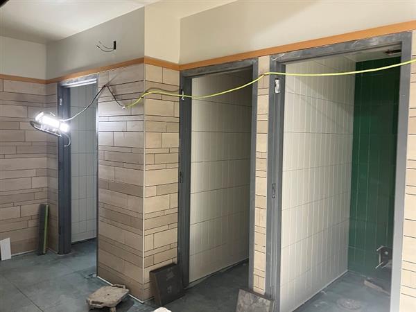 Tile work in inclusive restroom